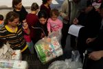Displaced Iraqi Christian women receive diapers for their infants and toddlers, supplied by the Diapers for Refugees program
